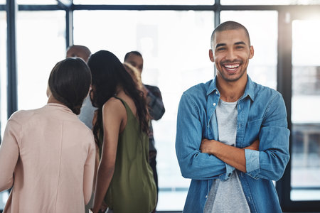 Laughing, workshop or portrait of happy man with business people for coaching, meeting or planning. Smile, learning or proud designer with confidence for skills development, opportunity or trainingの写真素材