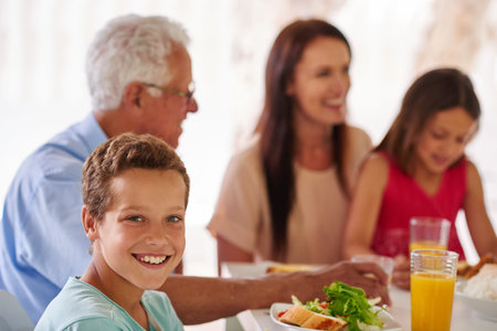 Family, food and portrait of child in home for bonding at feast, festive celebration and holiday....