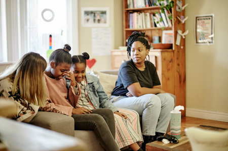 Family, therapy and mother with crying children in counseling session, consulting and help for parenting. Psychology, mental health and mom with kids at therapist with problem, divorce and emotionalの写真素材