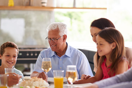 Big family, lunch and happy in home with children, drink and glass with champagne, juice and...