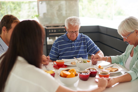Family, food and holding hands in kitchen for prayer, thanksgiving and gratitude at breakfast....