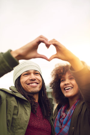 Heart hands, outdoor and couple with support, happiness and travel with kindness, icon and bonding...