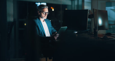Mature man, night and tablet at desk, financial consultant and online for trading trend. Accounting,...