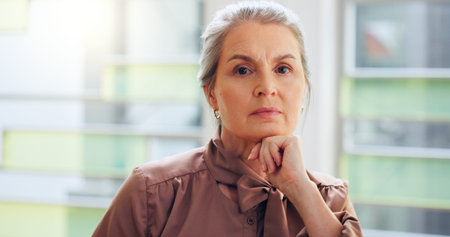 Serious, pride and portrait of mature businesswoman in office with finance career for investment...