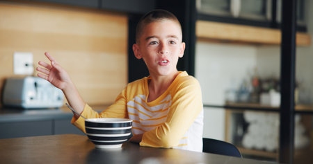 Breakfast, child and cereal with talking in kitchen for healthy development, morning routine and...