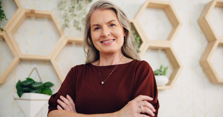 Happy woman, confident or mature manager in hotel lobby for accommodation, portrait or lodge. Face,...