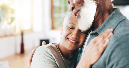 Home, senior couple and hug for love, support or connection to partner in marriage. Interracial,...