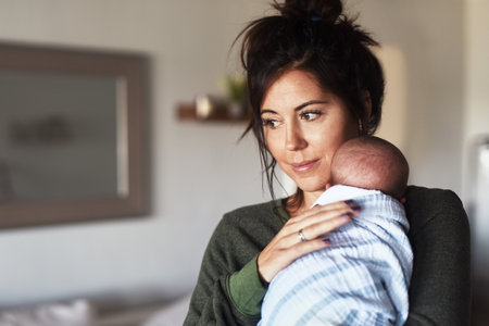 Mother, baby and relax for love, care and support with bonding, connection and development in home. Mom, woman and newborn in apartment for motherhood, growth and relationship with family on weekendの写真素材