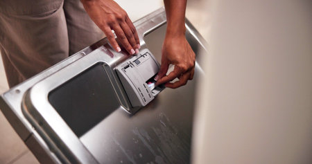 Cleaning, hands and tablet in dishwasher in home for housekeeping service or domestic work in...