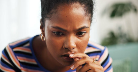 Thinking, student and worry with woman at home for university loan, reflection and scholarship fail....