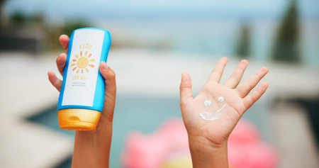 Sunscreen, smile drawing and hand with child at swimming pool for uv rays protection, spf cream or...