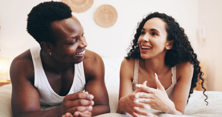 Talking, happy and couple in bedroom in morning for relaxing, conversation and bonding in hotel....