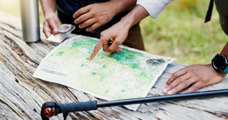 Hands, people and maps for hiking outdoor of trekking directions, forest navigation and compass....