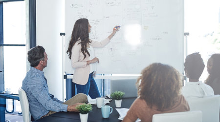 Presentation, meeting and teaching with business woman for speaker, exhibition planner or idea. Convention guideline, team and expo checklist with people in event organizer agency for projectの写真素材