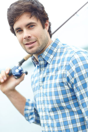 Holiday, man and fishing pole at river for vacation, portrait and travel for sport by lake in...
