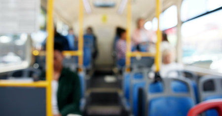 Bus, blur and seats for driving with public transport, people and together on journey, route or commute. Vehicle, moving and ride with services for travel, tourism or traffic in morning on urban roadの写真素材