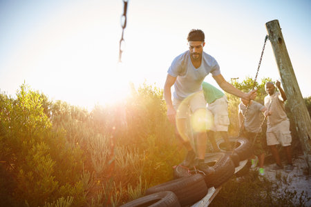 Men, obstacle course and outdoor for balance, fitness and bootcamp tire beam for endurance. Friends,...