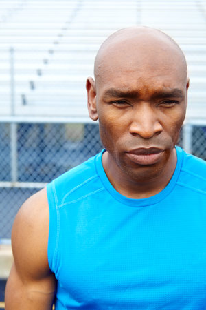 Runner, outdoor and black man with fitness, training and wellness with challenge. African person, athlete and healthy guy with confidence, muscular and practice with exercise, workout and routineの写真素材