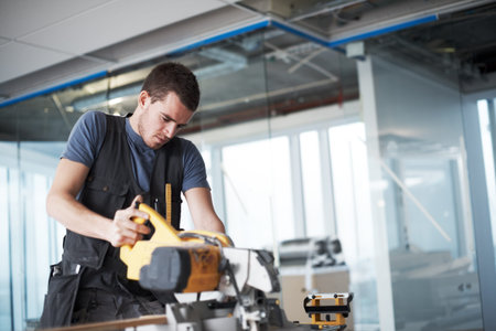 Contractor, handyman and tools with man and saw in office for renovation, maintenance and repair....