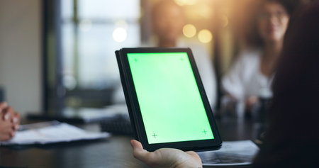 Business people, hand and tablet with green screen in meeting, presentation or team discussion at...