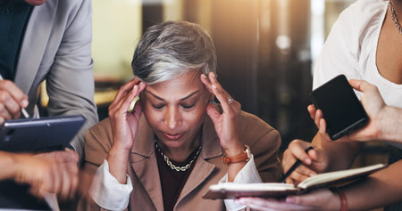 Stress, multitasking and business woman with team and headache for pressure, chaos and fatigue....