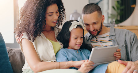 Mom, dad and child on sofa with tablet, smile and bonding together in home with online game, movie...