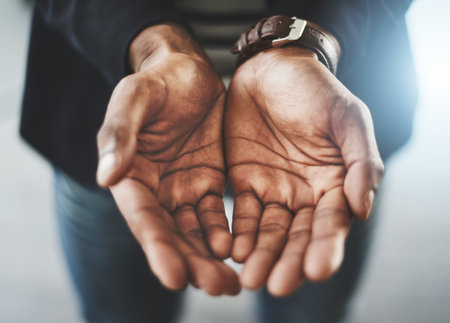 Open, hands and business person for charity in office asking for support, help and donation. Professional, startup company and worker with palm gesture for giving, financial aid and investmentの写真素材