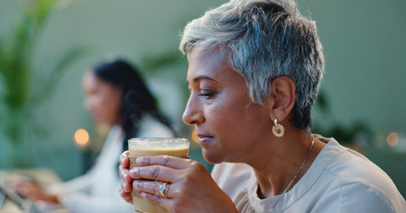 Business, thinking or senior woman with coffee in office for idea inspiration, solution or idea motivation. Question, why or old female executive with caffeine for creative startup problem solvingの写真素材