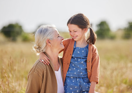 Grandmother, girl and happy together in field for travel adventure, bonding and weekend break....