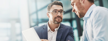 Tablet, meeting and business men in office with research for online stock market investment. Discussion, team and male financial advisors with digital technology for company capital gain proposal.の写真素材