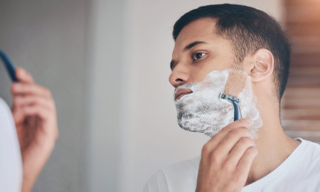 Shaving, mirror and man in bathroom with facial care, cleaning and getting ready in morning....