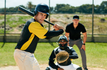 Man, baseball and athlete with bat in portrait, outdoor pitch and training or practice. Male person, player and sports competition or fitness tournament, field and score at match or game in arenaの写真素材