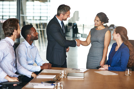 Shaking hands, offer and business people in office with client for investment deal, meeting or...