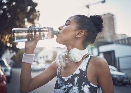 Woman, city and athlete for drinking water on break, fitness and mineral liquid for nutrition....
