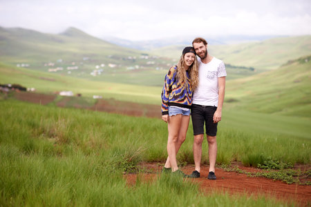 Couple, travel and happy with portrait in countryside for holiday weekend, vacation adventure and...