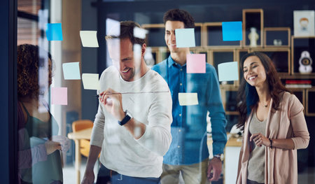 Happy, business people or brainstorming with team for schedule planning, project or meeting on glass...