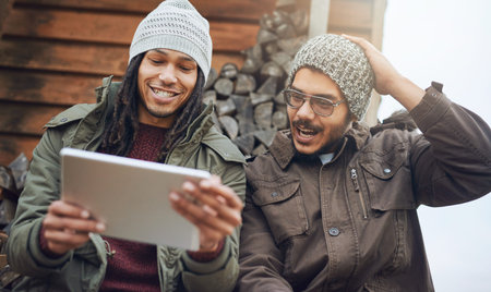 Happy men, camping and browsing with tablet on patio in nature for connectivity, signal or online...