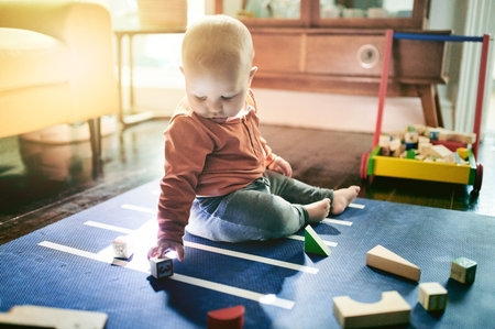 Education, toys and building blocks with baby on floor of living room for child development,...