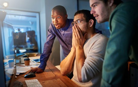 Business people, surprise and computer for email in office, night and negotiation deal success....