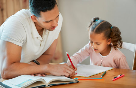 Dad, child or writing with book for homeschool, learning or education together at home. Father, kid or helping little girl with homework, project or preschool assignment for teaching or tutoringの写真素材