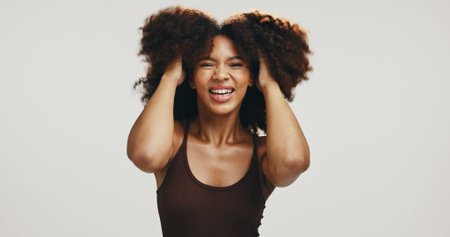 Smile, hair and portrait of woman in studio for volume, natural texture and beauty. Happiness, self...