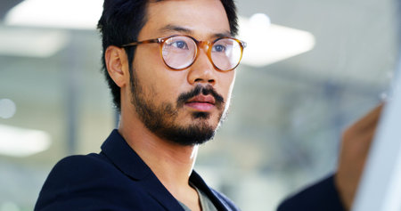 Writing, glasses and business with Asian man in office for planning, brainstorming and ideas for...