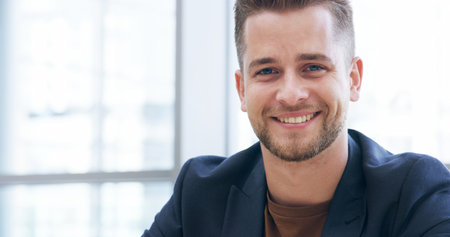 Portrait, smile and man in office, confident and ambitious for career growth in corporate company....