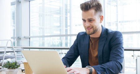 Smile, research and laptop with business man in office for client portfolio, investment banker and...
