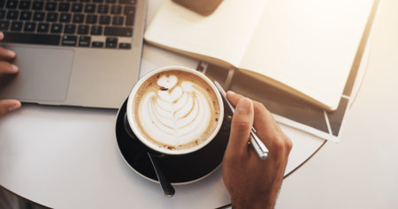 Coffee shop, laptop and above of hands with notebook for copywriting, journalism and editing career....
