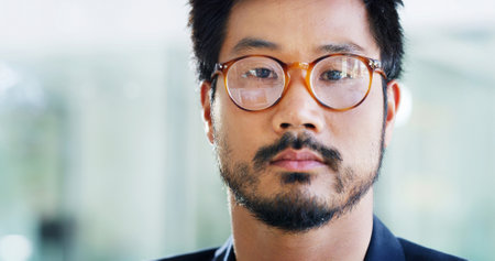 Portrait, asian man and sight with glasses for business ambition, mindset or creative design at office. Face, male person or designer with space, frame or lens for optometry aid or career commitmentの写真素材