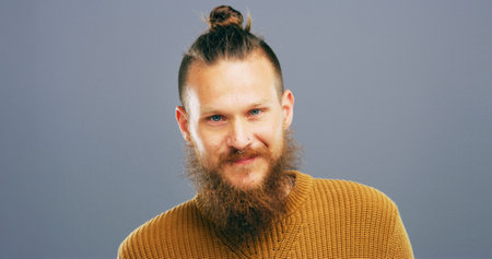 Creative, portrait and man with smile, studio and positive mindset for career growth, professional and business. Gray background, mockup space and writer person with freelancer, happy and confidenceの写真素材