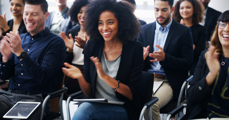 Business woman, group and applause at conference for corporate event, smile with support and praise. Audience, team and professional people clapping for seminar success, congratulations or cheersの写真素材