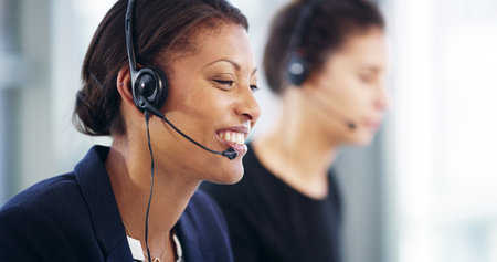 Consulting business, happy woman or smile for customer service, telemarketing sales or support. Call center, consultant or virtual assistant with headset for feedback, listening or communicationの写真素材
