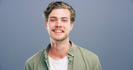 Happy man, portrait and casual fashion with style in studio of model or student on a gray background. Face, male person or gen z with smile in joy for facial expression or emotion on mockup spaceの写真素材